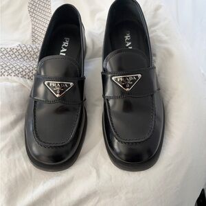 Prada Black Leather Logo Triangle Penny Loafers